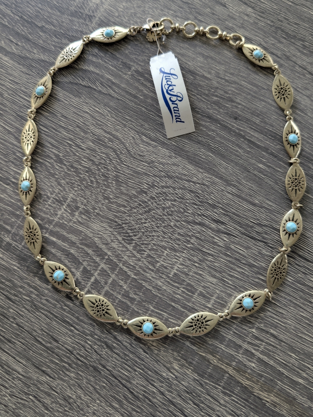 NWT Lucky Brand Turquoise Necklace with gold-tone sunburst and leaf motifs